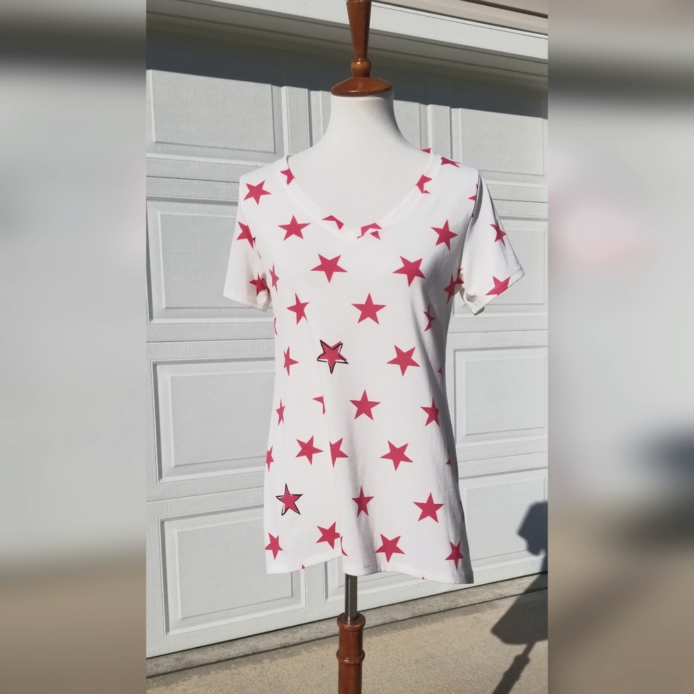 White top with pink stars